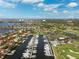 Aerial view of harbor with yacht club and golf course in waterfront community at 5950 Pelican Bay S Plz # Ph-2F, Gulfport, FL 33707