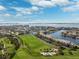 Beautiful aerial view showcasing the golf course, waterfront condos, and surrounding bay at 5950 Pelican Bay S Plz # Ph-2F, Gulfport, FL 33707