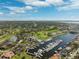 Scenic aerial view of golf course, yacht club, harbor with boat slips and waterfront homes at 5950 Pelican Bay S Plz # Ph-2F, Gulfport, FL 33707