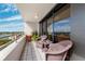 Cozy condo balcony with wicker chairs and city views at 5950 Pelican Bay S Plz # Ph-2F, Gulfport, FL 33707