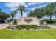 Well-manicured lawn and sign reading: Pasadena Yacht & Country Club Communities at 5950 Pelican Bay S Plz # Ph-2F, Gulfport, FL 33707
