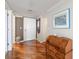 Entryway with hardwood floors, decorative vase, and a wooden desk at 5950 Pelican Bay S Plz # Ph-2F, Gulfport, FL 33707