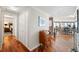 Hallway with hardwood flooring leading to a bedroom, closet and the living area at 5950 Pelican Bay S Plz # Ph-2F, Gulfport, FL 33707