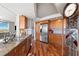 Kitchen boasts stainless appliances, hardwood floors, and granite countertops at 5950 Pelican Bay S Plz # Ph-2F, Gulfport, FL 33707