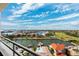 Scenic water view showcasing intercoastal waterway, residential homes, and a clear blue sky with clouds at 5950 Pelican Bay S Plz # Ph-2F, Gulfport, FL 33707
