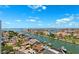 Expansive aerial view of luxury waterfront homes on canals with boat docks and stunning blue sky and waterway views at 5950 Pelican Bay S Plz # Ph-2F, Gulfport, FL 33707