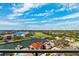Expansive aerial view showcasing the community's waterways, lush green spaces, and luxurious waterfront properties at 5950 Pelican Bay S Plz # Ph-2F, Gulfport, FL 33707