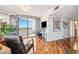 Stylish living room with a private balcony, hardwood floors, large windows, and comfortable seating arrangements at 5950 Pelican Bay S Plz # Ph-2F, Gulfport, FL 33707