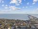 An aerial shot of the waterfront neighborhood with bay access and a bridge in distance at 6007 Anchorage Way, St Petersburg, FL 33712