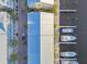 Overhead shot of waterfront townhomes, docks and boats showcasing coastal living with a view of a private marina at 6007 Anchorage Way, St Petersburg, FL 33712