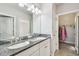 Bathroom features granite double vanity and access to a spacious walk-in closet at 6007 Anchorage Way, St Petersburg, FL 33712