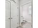 Hallway bathroom with toilet, sink, and storage at 6007 Anchorage Way, St Petersburg, FL 33712