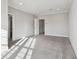Bright bedroom with plush carpet, neutral paint, and great natural light at 6007 Anchorage Way, St Petersburg, FL 33712