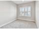 Cozy bedroom with neutral carpet, plantation shutters and white trim at 6007 Anchorage Way, St Petersburg, FL 33712