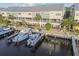 Exterior rear view from the water, featuring private boat docks for townhomes with screened in patios at 6007 Anchorage Way, St Petersburg, FL 33712