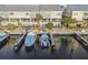 Exterior rear shot of the townhomes, showcasing docks with slips for large boats directly behind the residences at 6007 Anchorage Way, St Petersburg, FL 33712
