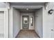 Inviting covered entryway with brick flooring, offering a warm welcome to visitors and residents at 6007 Anchorage Way, St Petersburg, FL 33712