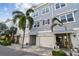 Attractive townhomes with shingle siding, two-car garages, and lush landscaping; perfect for coastal living at 6007 Anchorage Way, St Petersburg, FL 33712