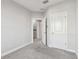 Upstairs hallway with neutral carpet and white trim at 6007 Anchorage Way, St Petersburg, FL 33712