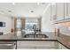 Stylish kitchen with an island sink boasts a view of the adjacent living area at 6007 Anchorage Way, St Petersburg, FL 33712