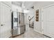 Stainless steel refrigerator is featured in this bright and modern kitchen area at 6007 Anchorage Way, St Petersburg, FL 33712