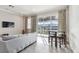 Living room boasts tile floors, recessed lighting, and a glass-door balcony overlooking the harbor at 6007 Anchorage Way, St Petersburg, FL 33712