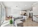 Bright living room and kitchen boasts tile floors, recessed lighting, and stainless steel appliances at 6007 Anchorage Way, St Petersburg, FL 33712
