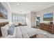 Relaxing main bedroom with plush bedding, natural light, and an en-suite bathroom at 6007 Anchorage Way, St Petersburg, FL 33712