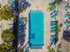 Birds eye view of a rectangular pool with sundeck and plenty of lounge seating at 6007 Anchorage Way, St Petersburg, FL 33712