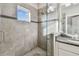 Modern bathroom shower with tiled walls, glass door, and stylish fixtures at 6007 Anchorage Way, St Petersburg, FL 33712
