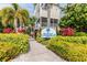 Entrance to the property showcasing lush landscaping and Cove at Loggerhead Marina signage at 6007 Anchorage Way, St Petersburg, FL 33712