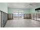Bright bedroom with water views, white flooring, and partially finished walls, ready for customization at 673 Boca Ciega Point N Blvd, St Petersburg, FL 33708