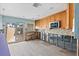 Renovating kitchen featuring custom cabinets, modern tile backsplash, and an open layout at 673 Boca Ciega Point N Blvd, St Petersburg, FL 33708