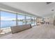 Spacious room with panoramic waterfront views and floor-to-ceiling windows at 673 Boca Ciega Point N Blvd, St Petersburg, FL 33708