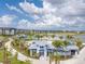 Community aerial view featuring a pool, lake, and luxury apartments at 7213 Sutton Ln, Sarasota, FL 34240