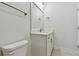 Modern bathroom featuring an updated vanity, decorative lighting, and contemporary fixtures at 7213 Sutton Ln, Sarasota, FL 34240