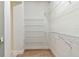 Walk-in closet with carpeted floors and wire shelving providing ample storage space at 7213 Sutton Ln, Sarasota, FL 34240
