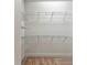 Walk-in closet with carpeted floors and wire shelving providing ample storage space at 7213 Sutton Ln, Sarasota, FL 34240