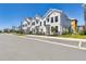 New three-story townhomes boast modern architecture, neutral colors, and well-kept landscaping for curb appeal at 7213 Sutton Ln, Sarasota, FL 34240