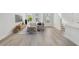 Bright living room with sleek flooring, modern furniture, and large windows for ample natural light at 7213 Sutton Ln, Sarasota, FL 34240