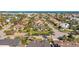 Serene aerial view of a residential neighborhood with lush landscaping, palm trees, and beautiful homes near a blue ocean at 725 Monte Cristo Blvd, Tierra Verde, FL 33715