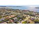 Stunning aerial of homes near waterfront, showcasing mature landscaping and well-maintained lawns in a desirable residential community at 725 Monte Cristo Blvd, Tierra Verde, FL 33715