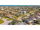 Aerial view of a residential neighborhood with well-maintained homes, lush landscaping, and easy access to the bay at 725 Monte Cristo Blvd, Tierra Verde, FL 33715
