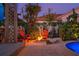 Outdoor fire pit area with stone surround, perfect for entertaining and enjoying the cool evenings at 725 Monte Cristo Blvd, Tierra Verde, FL 33715