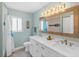 Bathroom featuring a large mirror, double sinks and shower over tub at 725 Monte Cristo Blvd, Tierra Verde, FL 33715