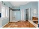 Well-lit bathroom with tiled floors, walk-in shower, and a modern vanity at 725 Monte Cristo Blvd, Tierra Verde, FL 33715