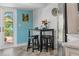 Charming breakfast nook with seating for three, next to a stainless steel refrigerator at 725 Monte Cristo Blvd, Tierra Verde, FL 33715