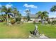 Well-manicured front yard with lush lawn, tropical plants, and attractive mailbox at 725 Monte Cristo Blvd, Tierra Verde, FL 33715