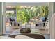 Lanai with lounge chairs and a view of a small waterfall and lush vegetation at 725 Monte Cristo Blvd, Tierra Verde, FL 33715