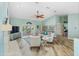 Bright and airy living room with high ceilings, skylights, and access to the outdoor living area at 725 Monte Cristo Blvd, Tierra Verde, FL 33715